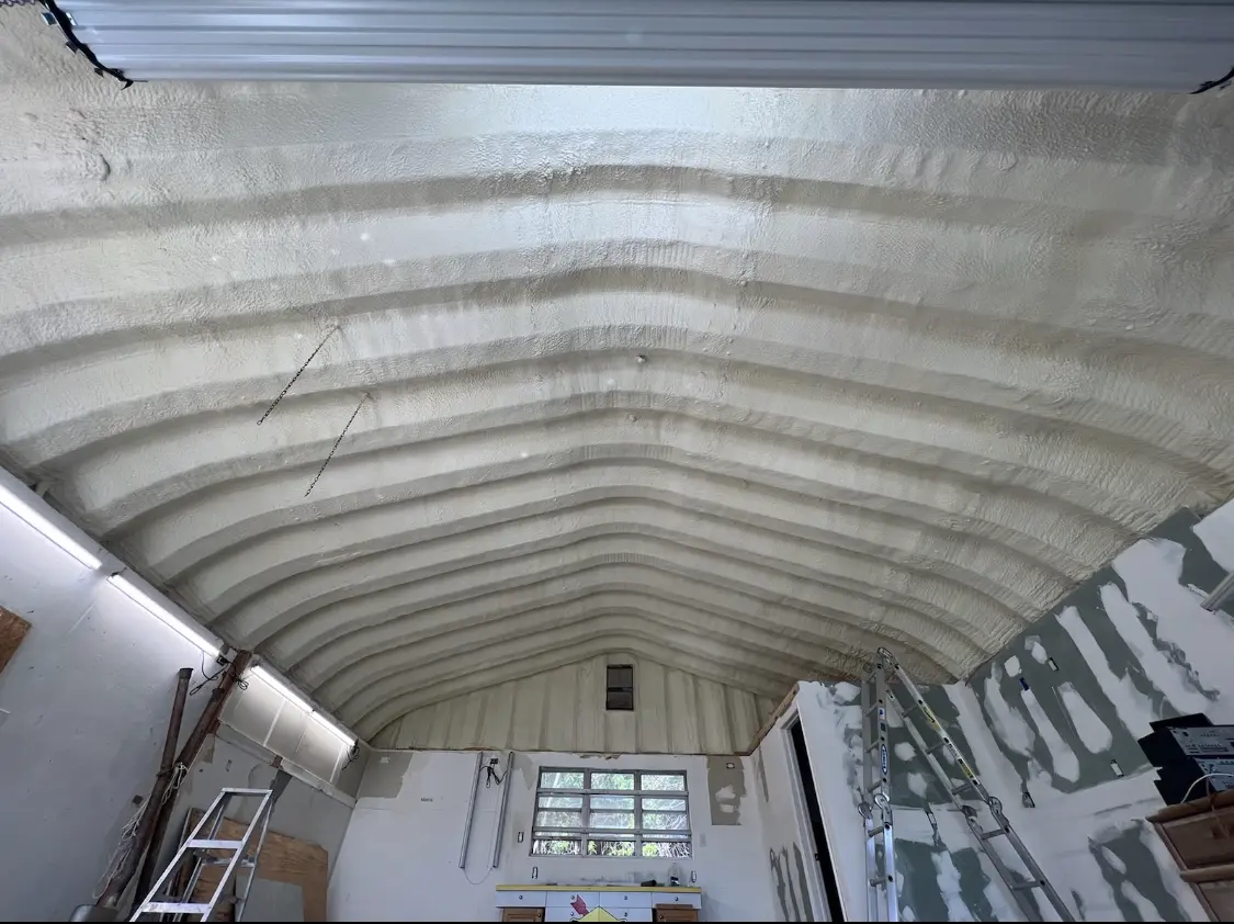 Spray polyurethane foam applied to the underside of a metal roof deck in Grandview